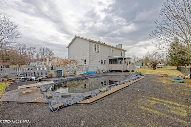 18 Molly White Dr, Coxsackie, NY 12051 - rear view of property with fence, a patio area, a fire pit, and a sunroom