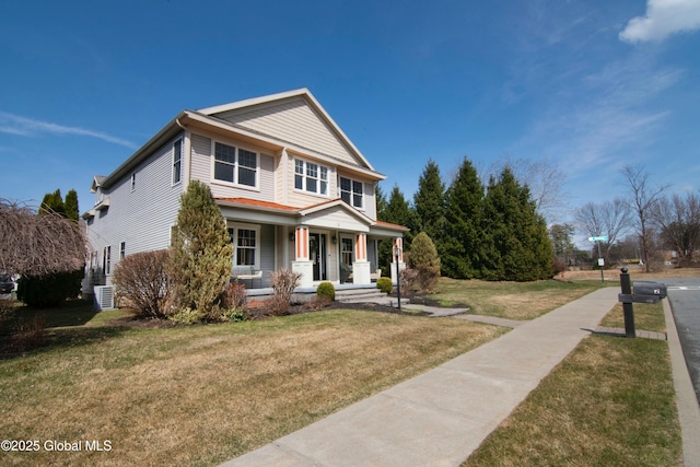 view of front of home with a front yard and a porch