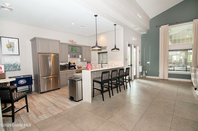 kitchen featuring open shelves, appliances with stainless steel finishes, a peninsula, gray cabinetry, and visible vents