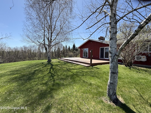 view of yard featuring a wooden deck
