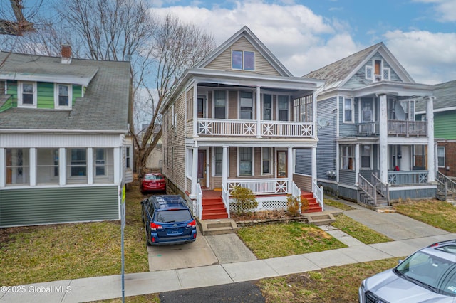 view of front of house with a balcony and a porch