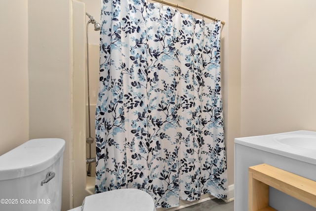 full bath with toilet and a sink