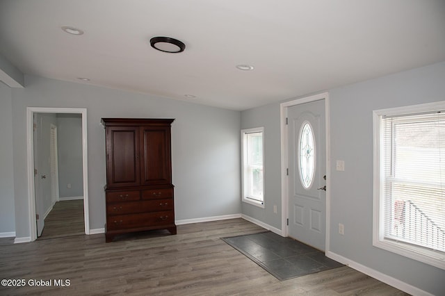 foyer entrance featuring wood finished floors, baseboards, lofted ceiling, and recessed lighting