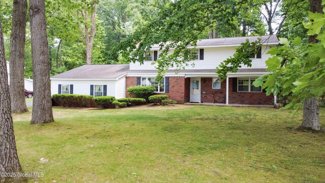 15 Garrison Ln, Clifton Park, NY 12019 - view of front of property featuring a front yard and brick siding