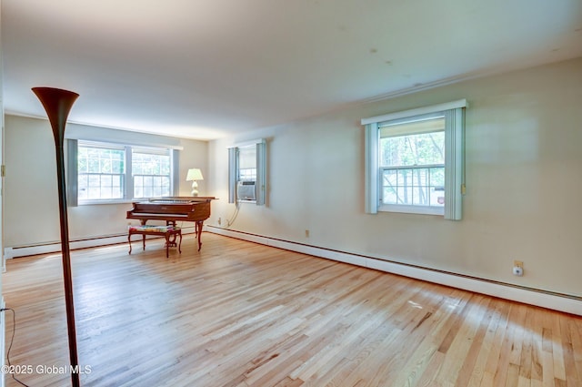 15 Garrison Ln, Clifton Park, NY 12019 - empty room featuring wood finished floors, baseboard heating, and cooling unit