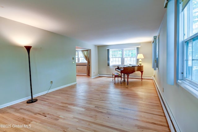 15 Garrison Ln, Clifton Park, NY 12019 - unfurnished room with light wood finished floors and baseboard heating