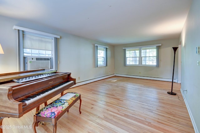 15 Garrison Ln, Clifton Park, NY 12019 - sitting room with cooling unit, wood finished floors, and a baseboard heating unit