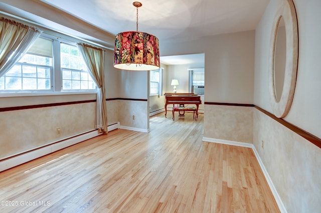 15 Garrison Ln, Clifton Park, NY 12019 - dining area featuring wood finished floors and a baseboard radiator