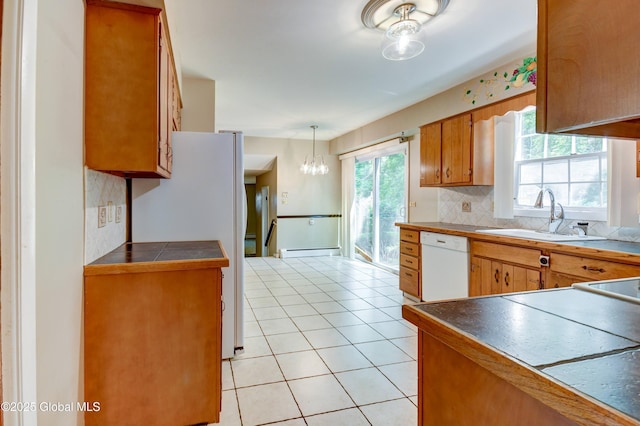 15 Garrison Ln, Clifton Park, NY 12019 - kitchen featuring white appliances, tasteful backsplash, brown cabinetry, a baseboard heating unit, and light tile patterned floors
