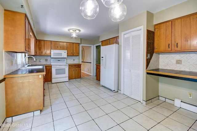 15 Garrison Ln, Clifton Park, NY 12019 - kitchen with white appliances, brown cabinets, backsplash, and light tile patterned flooring