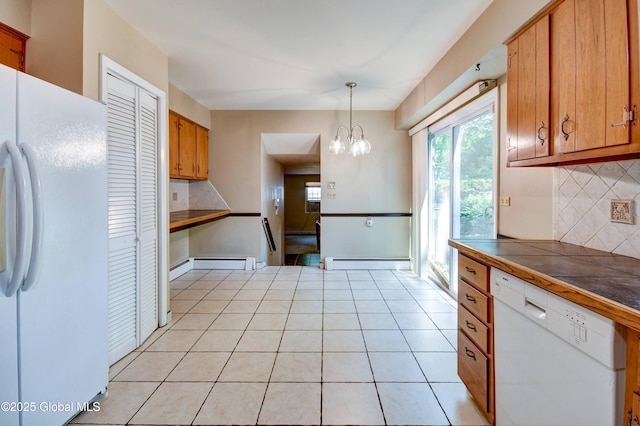 15 Garrison Ln, Clifton Park, NY 12019 - kitchen featuring white appliances, baseboard heating, tasteful backsplash, brown cabinetry, and tile counters