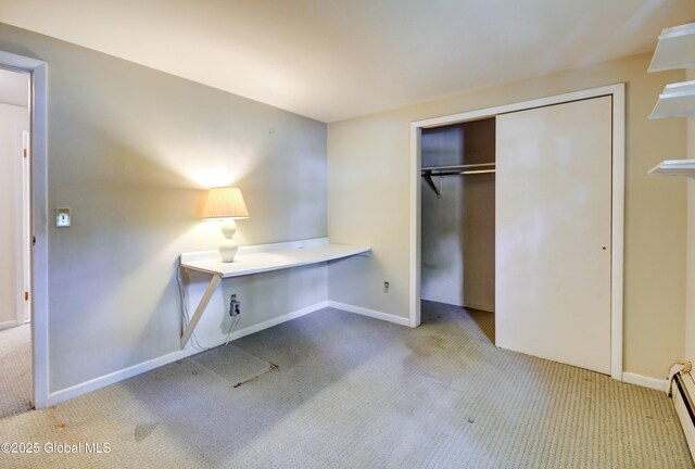 15 Garrison Ln, Clifton Park, NY 12019 - unfurnished bedroom featuring carpet flooring, a closet, and a baseboard radiator