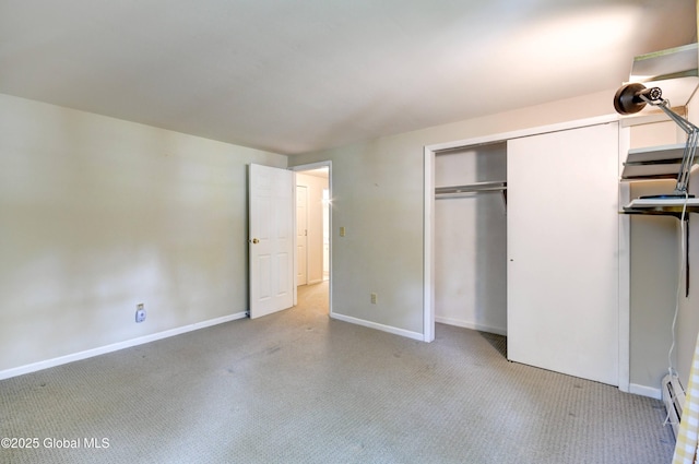 15 Garrison Ln, Clifton Park, NY 12019 - unfurnished bedroom with carpet floors, a closet, and a baseboard radiator