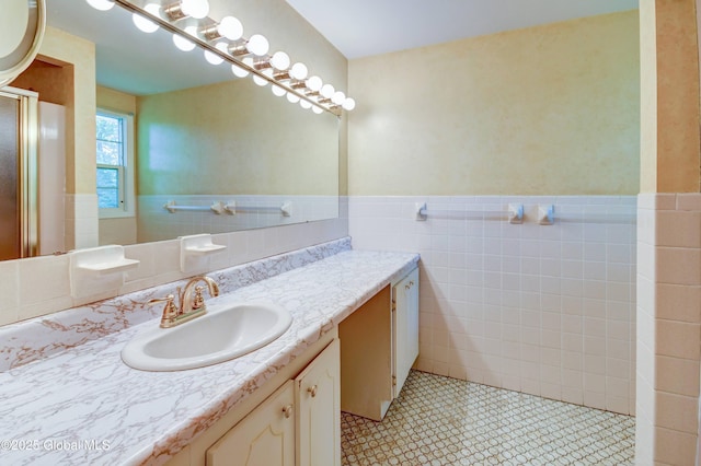 15 Garrison Ln, Clifton Park, NY 12019 - full bathroom featuring tile walls, vanity, wainscoting, and a shower with door