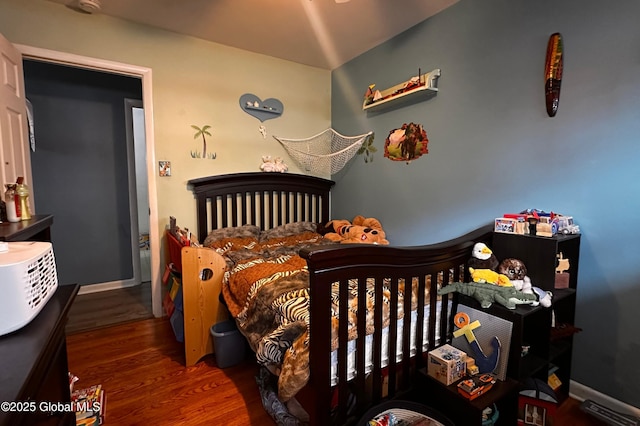 bedroom featuring wood finished floors