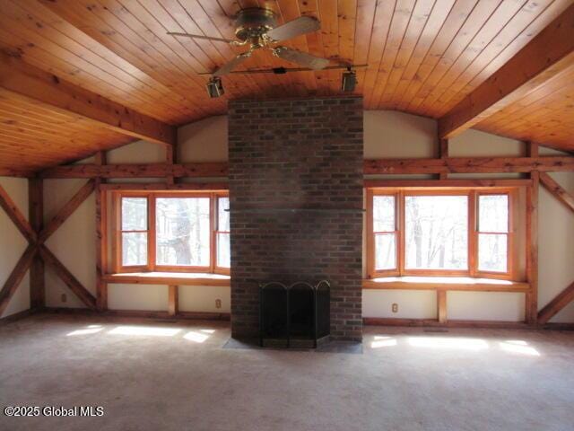 additional living space with carpet flooring, ceiling fan, lofted ceiling with beams, and wood ceiling