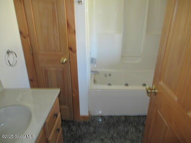 full bath featuring vanity and shower / bathtub combination
