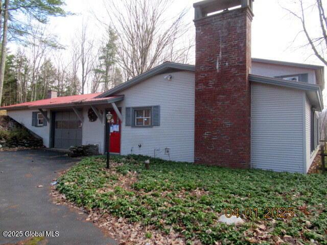545 Stage Rd, Cambridge, NY 12028 - view of front of property with aphalt driveway and a chimney