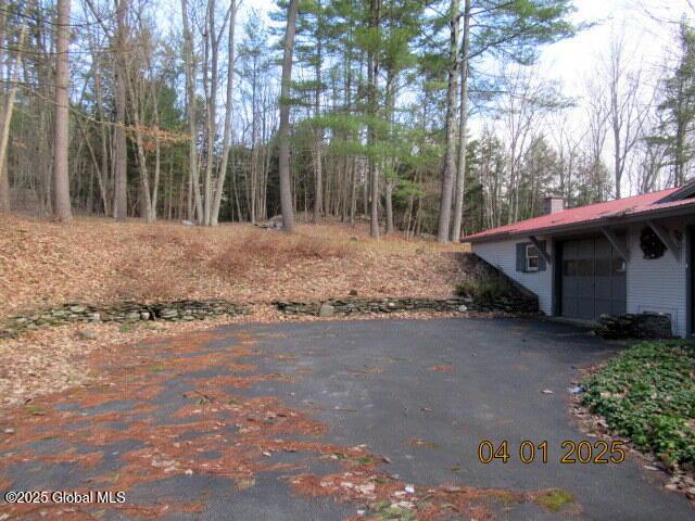 545 Stage Rd, Cambridge, NY 12028 - exterior space with an attached garage and aphalt driveway