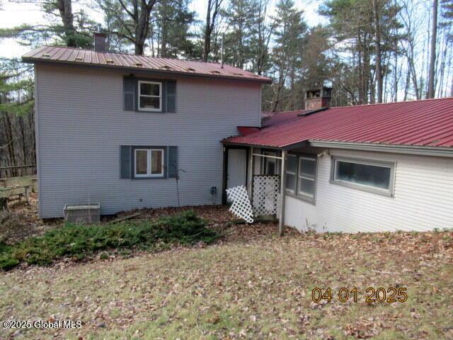 545 Stage Rd, Cambridge, NY 12028 - rear view of property featuring metal roof and a chimney