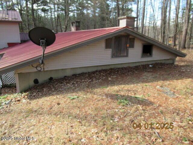 545 Stage Rd, Cambridge, NY 12028 - view of side of property featuring a chimney and metal roof