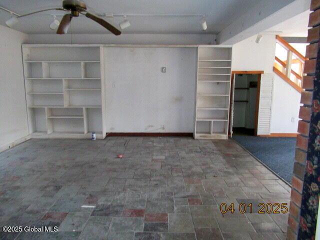 545 Stage Rd, Cambridge, NY 12028 - unfurnished living room with baseboards and ceiling fan