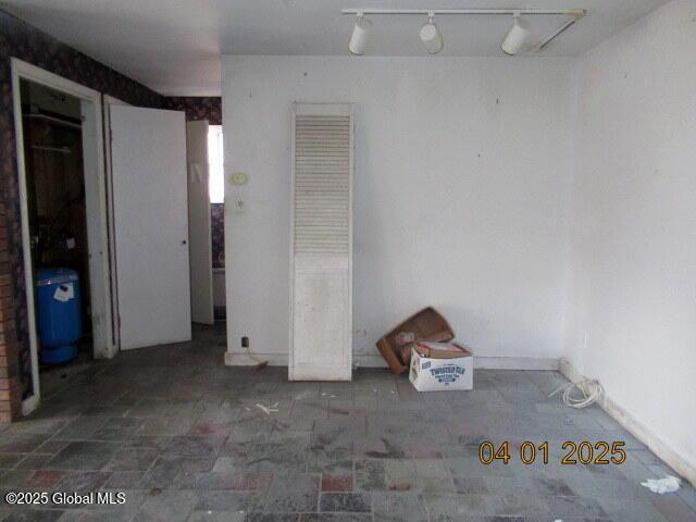 545 Stage Rd, Cambridge, NY 12028 - unfurnished bedroom with rail lighting and baseboards