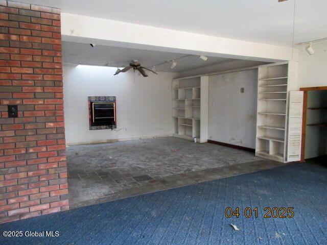 545 Stage Rd, Cambridge, NY 12028 - interior space featuring a fireplace, carpet flooring, and a ceiling fan