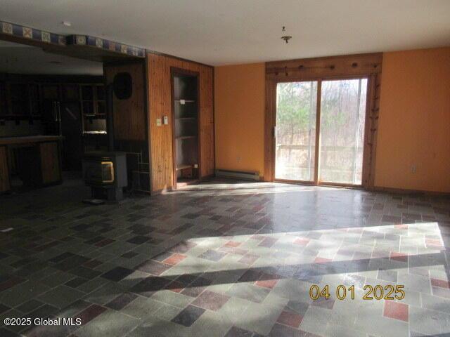 545 Stage Rd, Cambridge, NY 12028 - unfurnished living room with a wood stove