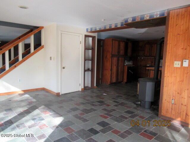 545 Stage Rd, Cambridge, NY 12028 - interior space with wood walls and stairway