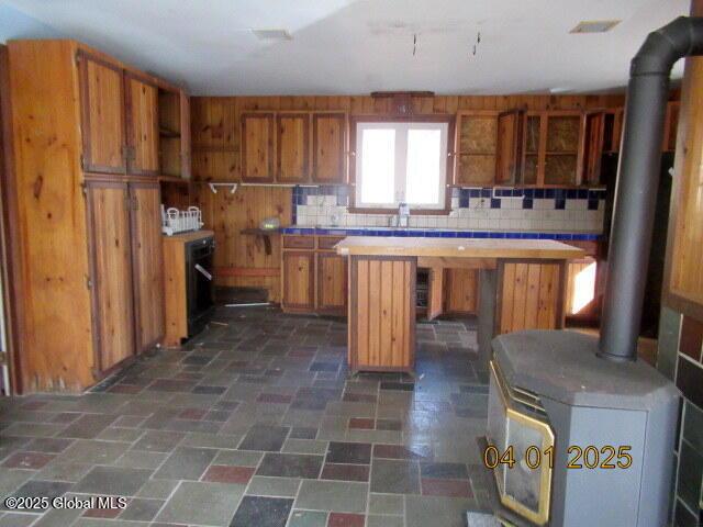 545 Stage Rd, Cambridge, NY 12028 - kitchen featuring backsplash, open shelves, and brown cabinetry
