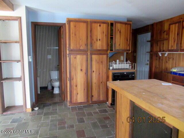 545 Stage Rd, Cambridge, NY 12028 - kitchen featuring brown cabinetry, open shelves, stone finish flooring, and light countertops
