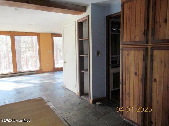 545 Stage Rd, Cambridge, NY 12028 - hallway with beam ceiling and a baseboard heating unit