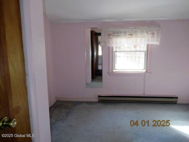 545 Stage Rd, Cambridge, NY 12028 - carpeted empty room featuring a baseboard heating unit