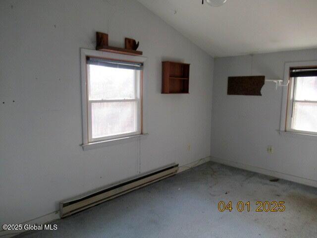 545 Stage Rd, Cambridge, NY 12028 - unfurnished room with light carpet, vaulted ceiling, and a baseboard heating unit