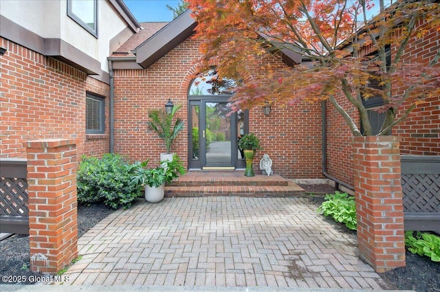 101 E Krumkill Rd, Albany, NY 12208 - doorway to property with brick siding and stucco siding