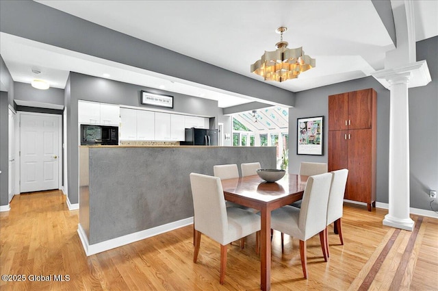 101 E Krumkill Rd, Albany, NY 12208 - dining room featuring decorative columns, baseboards, light wood finished floors, a chandelier, and recessed lighting