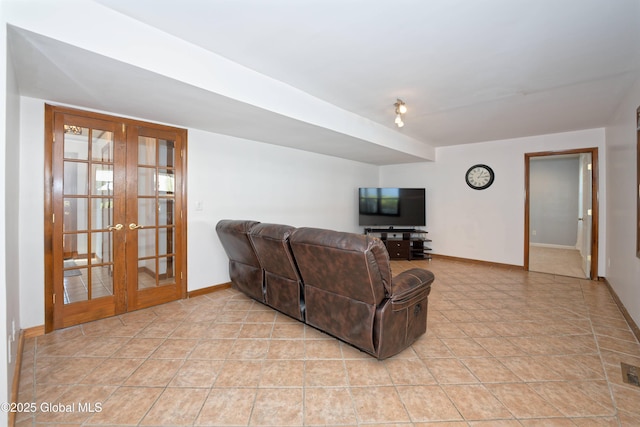 living area with baseboards, french doors, light tile patterned flooring, and visible vents