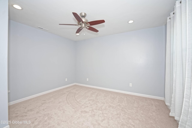 carpeted empty room featuring baseboards, a ceiling fan, and recessed lighting