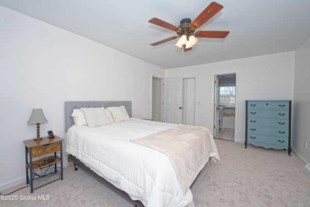 bedroom featuring baseboards, light carpet, and ceiling fan