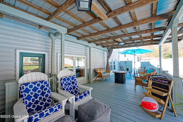 wooden deck featuring a fire pit