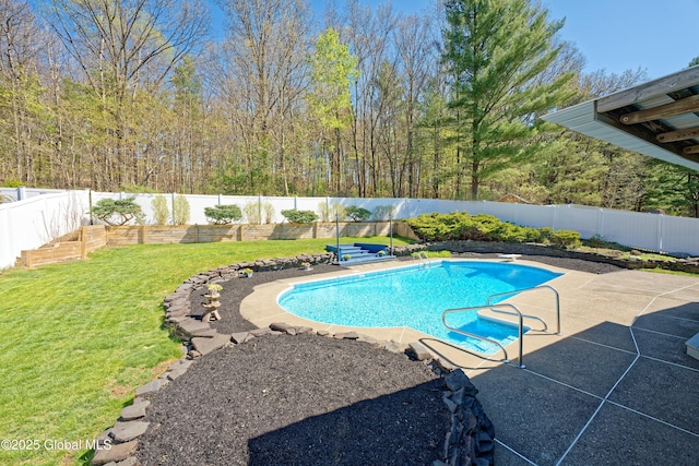 view of pool featuring a patio, a fenced backyard, a fenced in pool, a diving board, and a yard