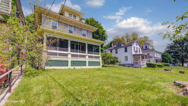 121 Guy Park Ave, Amsterdam, NY 12010 - rear view of house featuring a sunroom and stone siding