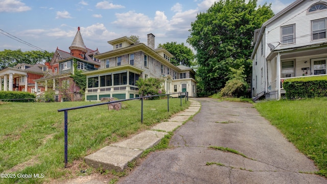 121 Guy Park Ave, Amsterdam, NY 12010 - view of front of house with a chimney and a sunroom