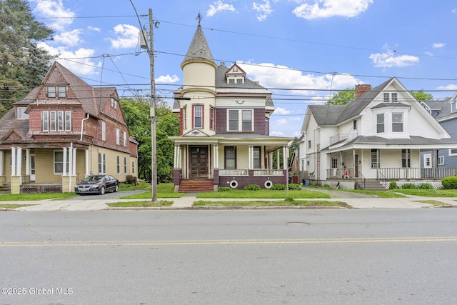 victorian house featuring covered porch