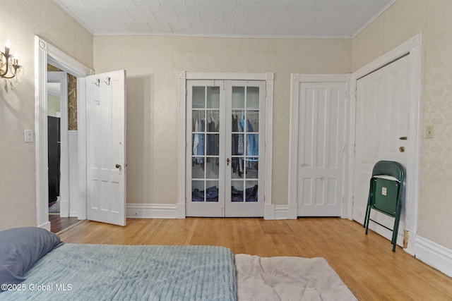 bedroom featuring crown molding and wood finished floors