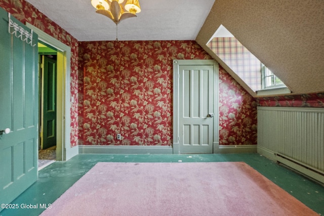 bonus room featuring wallpapered walls, baseboards, and carpet flooring