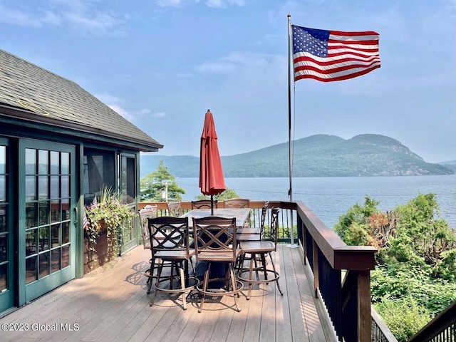 9667 Lake Shore Dr, Hague, NY 12836 - wooden terrace with a water and mountain view and outdoor dining space