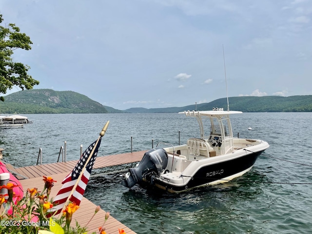 9667 Lake Shore Dr, Hague, NY 12836 - dock featuring a water and mountain view
