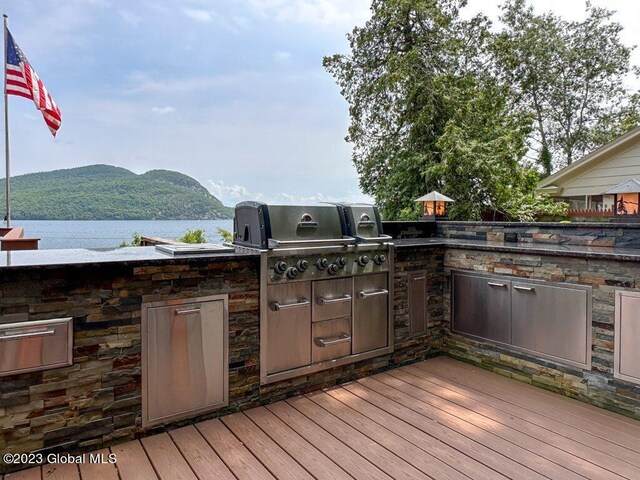 9667 Lake Shore Dr, Hague, NY 12836 - wooden terrace with a water and mountain view and area for grilling